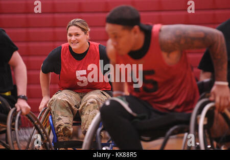 U.S. Army active duty and veteran athletes compete in wheelchair basketball for the 2017 Pacific Regional Warrior Game Trials Army Trials on Schofield Barracks, Hawaii, November 8, 2017. Approximately 80 wounded, ill or injured soldiers and veterans are in Hawaii to train and compete in a series of competitive athletic events including archery, cycling, shooting, sitting volleyball, swimming, track and field and wheelchair basketball. These competitions take place during November, which also coincides with Warrior Care Month. During Warrior Care Month we focus on activities that allow us to co Stock Photo