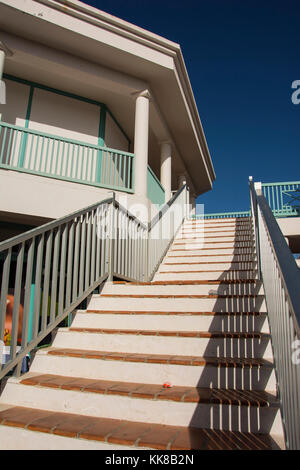 stone staircase with wooden handrails close up abstract outside in the daytime Stock Photo