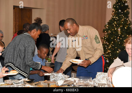 The 61st Air Base Group at Los Angeles Air Force Base hosted the annual Holiday Family Feast and special volunteer recognition held at the Fort MacArthur Community Center in San Pedro, Calif. Nov 16, 2017. All service branches living in base housing attended the festivities.     During the meal, Master Jerome Ginsberg was recognized for his 17 plus years working with military youth- dependents, as a martial arts instructor here at LA AFB by Col Charles Roberts, 61st Air Base Group commander. (U. S. Air Force photo/Joseph M. Juarez Sr.) Stock Photo