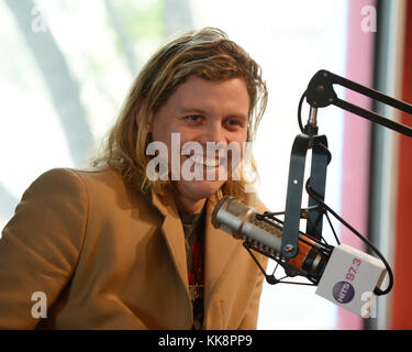 HOLLYWOOD, FL -  JANUARY 29: Jess Glenne and Conrad Sewell pose for a portrait at radio station 97.3 The Hits on January 29, 2016 in Hollywood, Florida.  People:  Conrad Sewell Stock Photo