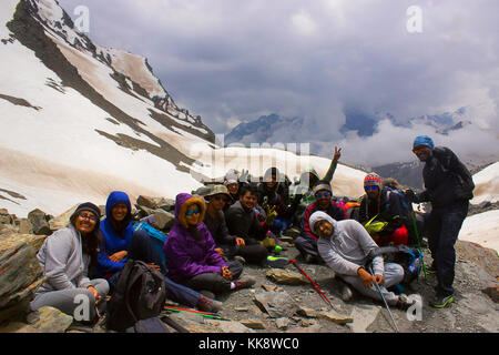 Happy bunch of Trekkers resting and celebrating Himachal Pradesh, Northern India Stock Photo