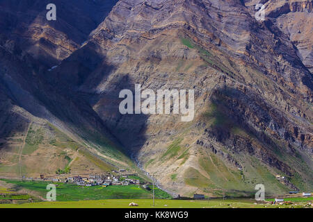 Long shot of settlements towards rocky mountain at Spiti Valley. Himachal Pradesh, Northern India Stock Photo