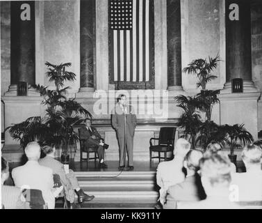 Photograph of Official Preview Freedom Train Exhibit: General Services Administration (GSA) Administrator Jess Larson speaking, Dr. Wayne C. Grover, Archivist of the United States, seated. Image courtesy National Archives, 1949. Stock Photo