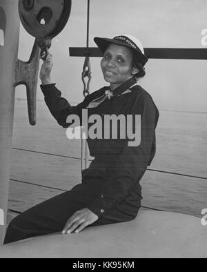 A photographic portrait of Olivia Hooker in her uniform, in 1945 she became the first African-American woman to join the United States Coast Guard, she was a member of the United States Coast Guard Womens Reserve which was known as spars until 1946 when her unit was disbanded, she achieved the rank of Yeoman Second Class in the Coast Guard Womens Reserve, she later went on to earn a PhD in psychology and became a college professor, Brooklyn, New York, 1943. From the New York Public Library. Stock Photo