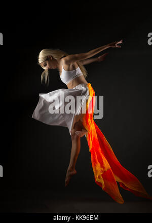 Studio dancing female mid air jumps Stock Photo