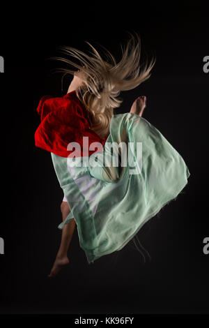 Studio dancing female mid air jumps Stock Photo