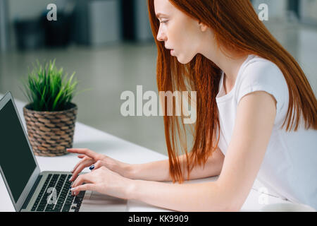 woman typing on laptop at workplace Woman working in home office hand keyboard Stock Photo