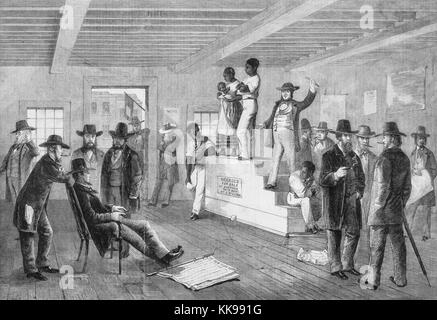 An etching from a painting of a slave auction, a black man stands next to a black woman holding her child on top of a raised platform, two other black men are seen leaning and sitting on the edges of the platform, a white auctioneer addresses the crowd of white men from the platform, the other men are standing and conversing throughout the room, Virginia, 1861. From the New York Public Library. Stock Photo