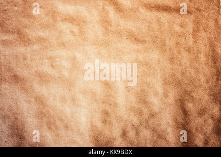 Texture detailed background craft wrapping wrinkled paper parchment recycled  vignetting toned macro shot Stock Photo