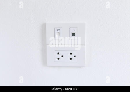 White electric plugs on wall background,White outlet interior, interior electric outlet in home,Socket electricity interior Stock Photo