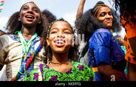 Three girls enter the main stage area at the Ashenda Festival, Mekele, Ethiopia. Stock Photo