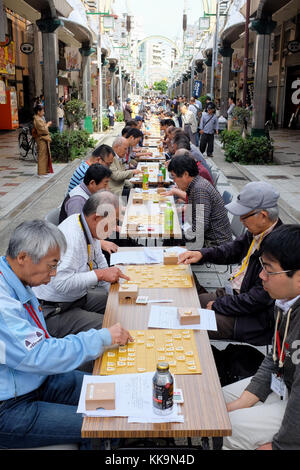 An outdoor shogi (also known as 'Japanese chess') competition being held in Osaka, Japan, in 2017. Stock Photo