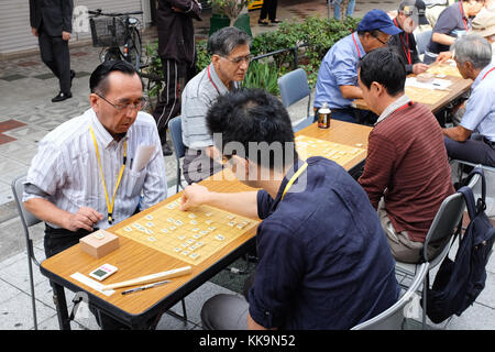 An outdoor shogi (also known as 'Japanese chess') competition being held in Osaka, Japan, in 2017. Stock Photo
