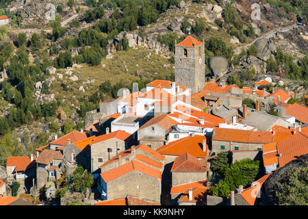 cityscape view of Monsanto village, Portugal, view on a main chapel and houses with red tile rooftops Stock Photo