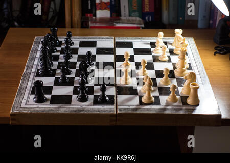 chess board from the side with multiple moves made game Stock Photo - Alamy