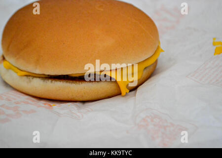 Homemade tasty cheeseburger at white paper Stock Photo