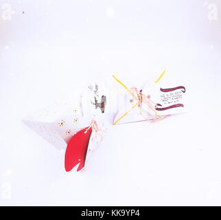 Christmas Decoration with cake slice gift boxes with snow falling for best background image for Holiday invitations and banners and blogs Stock Photo