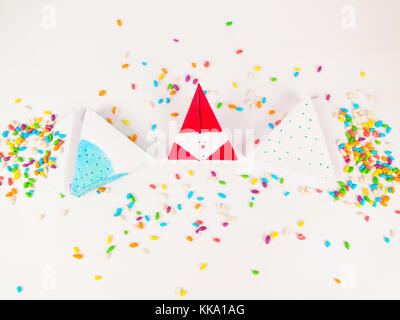 Christmas decoration triangle git boxes with colorful candies as confetti for celebration best Christmas holidays background image for invitation Stock Photo