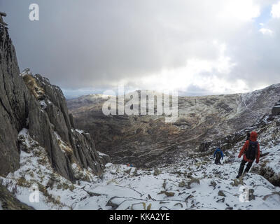 Walking in winter landscape, Tryfan, Ogwen Valley, Snowdonia, Wales, UK Stock Photo
