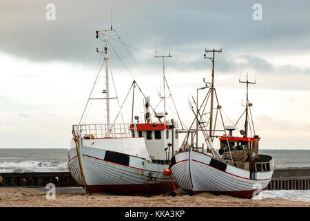 Fishing boat on the beach in the costline Stock Photo