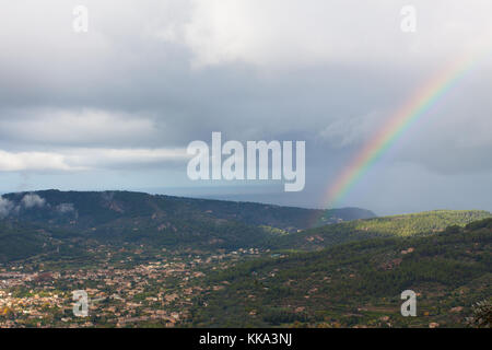 Rainbow over Soller Valley surrounded by the Serra de Tramuntana mountains. Majorca, Spain Stock Photo