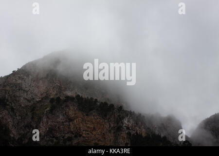 View of Es Cornador Gran peak covered with clouds. Soller, Majorca, Spain Stock Photo