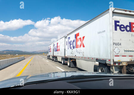 Fedex Truck on US highway. Triple Trailer Combination Road Train on Interstate I-80 in Nevada USA Stock Photo