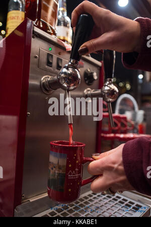 Lueneburg, Germany. 29th Nov, 2017. Mulled wine is sold on the Christmas market at the city hall in Lueneburg, Germany, 29 November 2017. The Christmas market is open until 22 December. Credit: Philipp Schulze/dpa/Alamy Live News Stock Photo