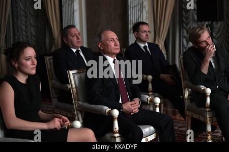 Moscow, Russia. 29th Nov, 2017. Russian President Vladimir Putin, center, watches the Russian film Furious with actor Ilya Malakov, right, and Polina Chernyshova, left, during a private screening November 29, 2017 in Moscow, Russia. Credit: Planetpix/Alamy Live News Stock Photo