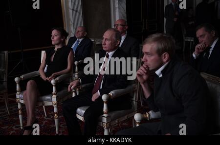 Moscow, Russia. 29th Nov, 2017. Russian President Vladimir Putin, center, watches the Russian film Furious with actor Ilya Malakov, right, and Polina Chernyshova, left, during a private screening November 29, 2017 in Moscow, Russia.  Credit: Planetpix/Alamy Live News Stock Photo