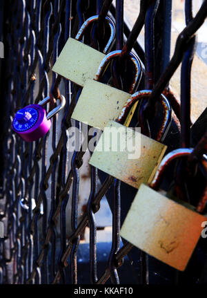 Keokuk, Iowa, USA. 10th Aug, 2017. Visitors to the Keokuk Bridge, also known as the Keokuk Municipal Bridge write their names and lock them to the fence on the end of the structure overlooking the Mississippi River and Lock and Dam number 19. Credit: Kevin E. Schmidt/Quad-City Times/ZUMA Wire/Alamy Live News Stock Photo