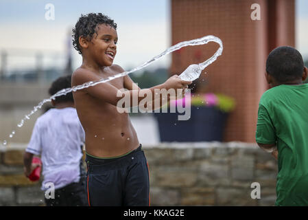 Rock Island, Iowa, USA. 2nd July, 2017. Isiah Westerfield, 9, of Rock Island splashes water at his brother, Isaac, 5, at Schwiebert Park in Rock Island, Illinois, on Sunday, July 2, 2017. Credit: Andy Abeyta, Quad-City Times/Quad-City Times/ZUMA Wire/Alamy Live News Stock Photo