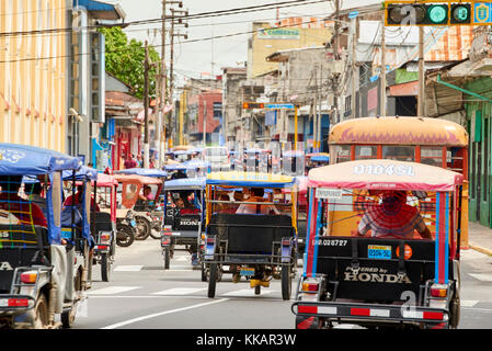 Mototaxis in a busy street in Iquitos, Peru, South America Stock Photo