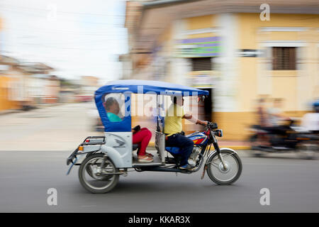 Panned shot of mototaxi in Iquitos, Peru, South America Stock Photo