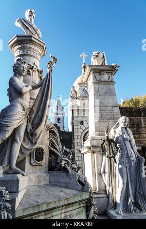 Statues at the entrance to vaults in La Recoleta Cemetery, which lies right in the heart of the city, Buenos Aires, Argentina, South America Stock Photo