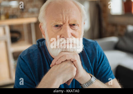 Smart wise man holding his chin Stock Photo