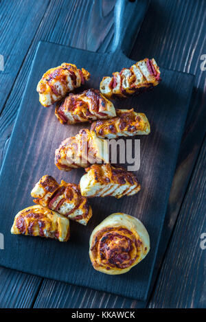 Pizza rolls on the wooden board Stock Photo