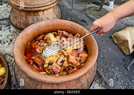 Elegant table setting with full serving of traditional fanesca soup and  accessories Stock Photo - Alamy