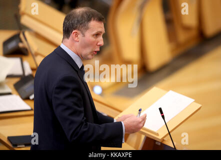 Justice Secretary Michael Matheson makes a statement in the main chamber of the Scottish Parliament, Edinburgh, after it emerged that Police Scotland has suspended four officers, including an assistant chief constables. Stock Photo