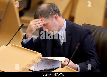 Justice Secretary Michael Matheson makes a statement in the main chamber of the Scottish Parliament, Edinburgh, after it emerged that Police Scotland has suspended four officers, including an assistant chief constables. Stock Photo