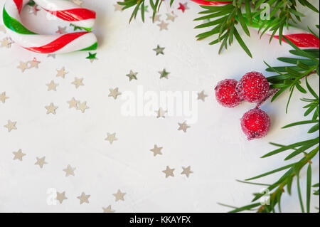 star shaped red confetti on white background. festive background Stock Photo