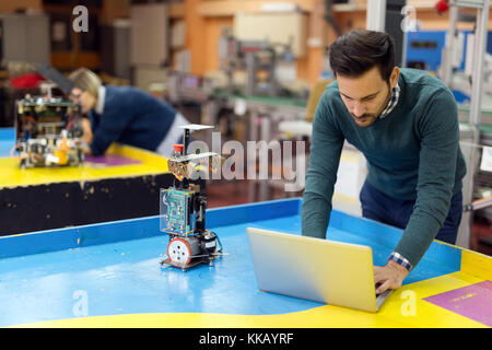 Young student of mechatronics working on project Stock Photo