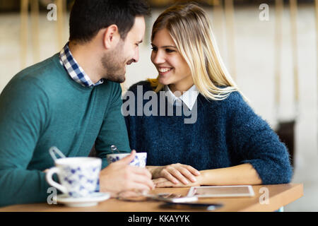 Happy young couple on date in coffee shop Stock Photo