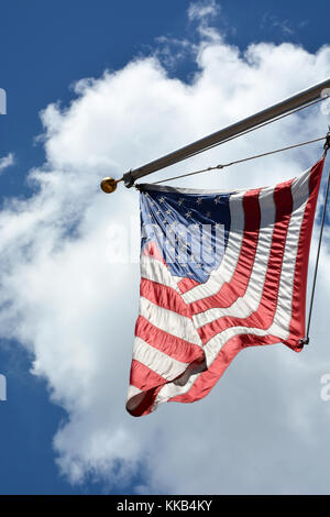 American flag against sky with puffy white clouds Stock Photo - Alamy