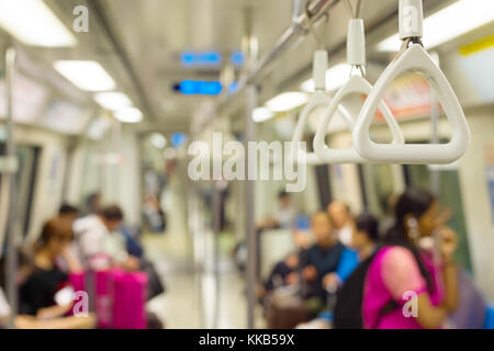 Inside the Singapore metro train. Focus on a handrail. Stock Photo