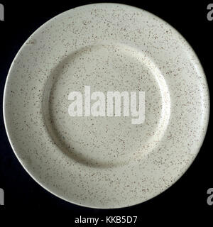 https://l450v.alamy.com/450v/kkb5d7/high-above-view-of-cream-colored-plate-isolated-on-black-background-kkb5d7.jpg