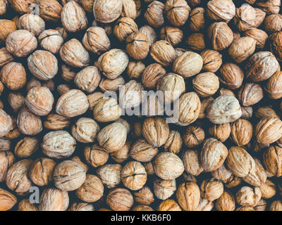 walnuts , pile of nuts, walnuts background Stock Photo