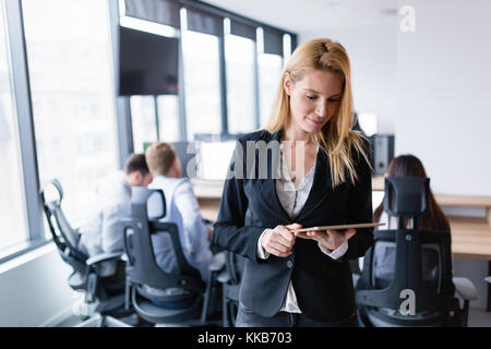 Beautiful businesswoman using digital tablet in office Stock Photo