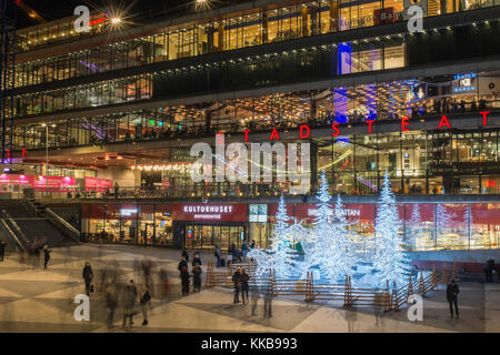 STOCKHOLM, SWEDEN - DECEMBER 9, 2016: Night view over Sergels Torg decorated with moose and trees sculptures made from led lights during Christmas sea Stock Photo