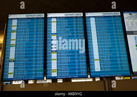 Flight information departures board screen display to various international destinations at LAX airport in Los Angeles California, USA    KATHY DEWITT Stock Photo